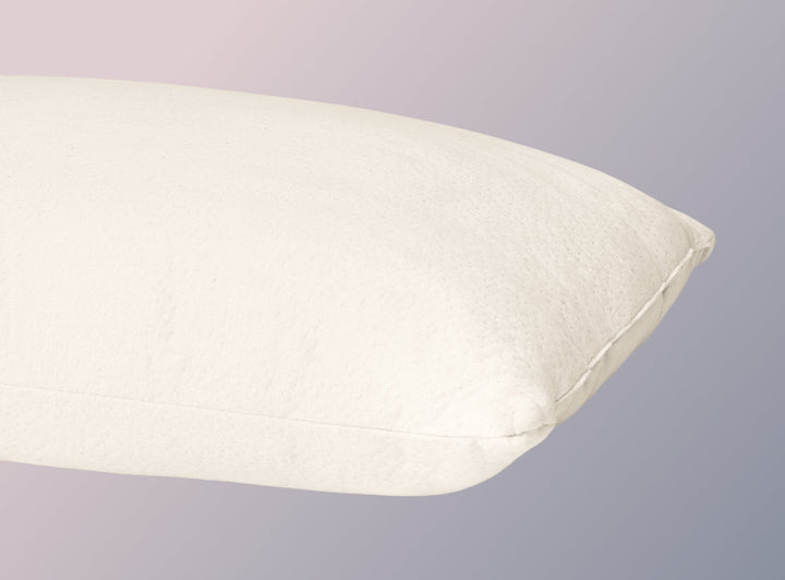 A closeup image of the Organic Pillow on a blue background