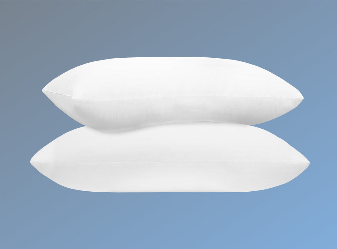 Two Dream Pillows stacked on a blue background