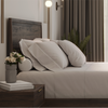 A closeup image of the Ludlow Bed Frame and Nightstand in a bedroom scene