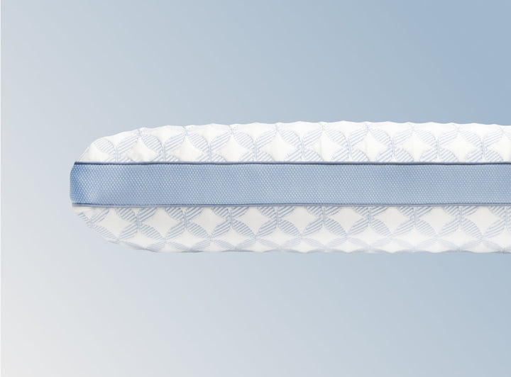 An image of the GlacioTex Cooling Pillow on a light blue gradient background