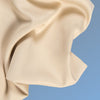 A closeup of the Cotton Blend Sheet Set on a blue background