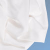 A closeup of the Cotton Blend Sheet Set on a blue background