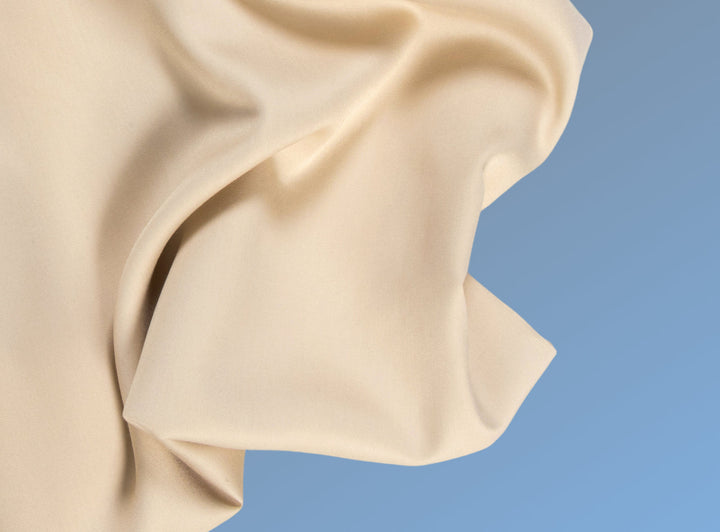 A closeup of the Cotton Blend Sheet Set on a blue background