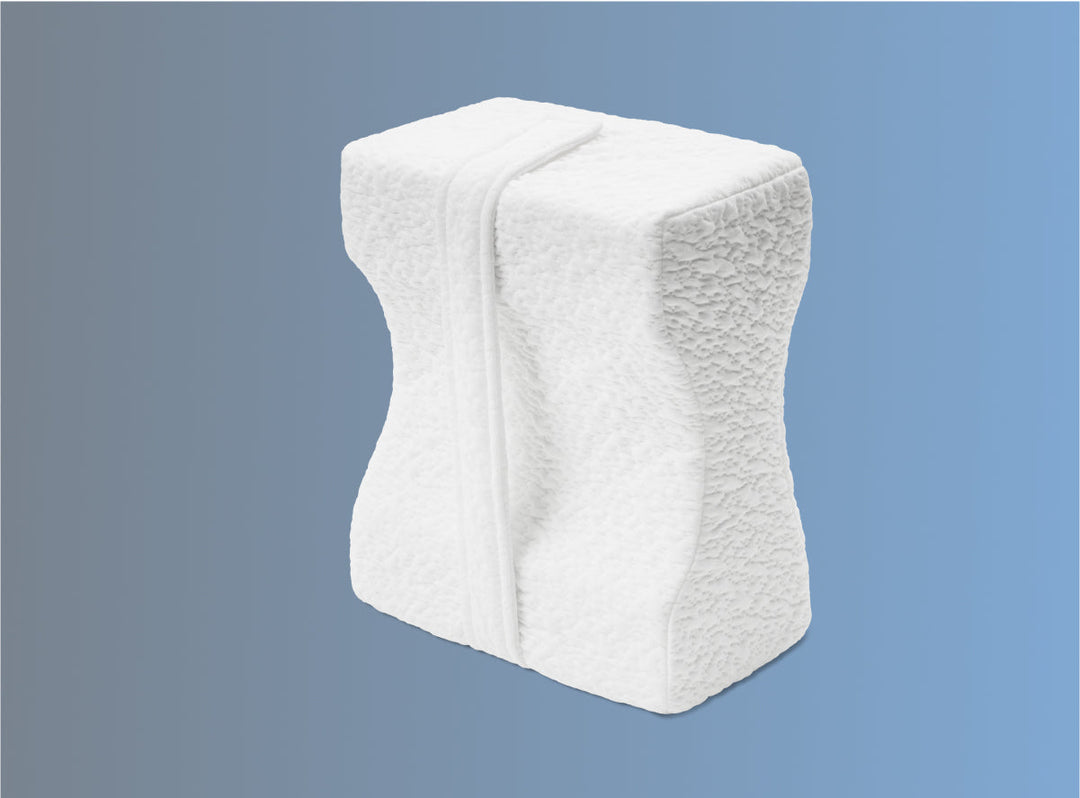 The Helix Knee Pillow on a blue background