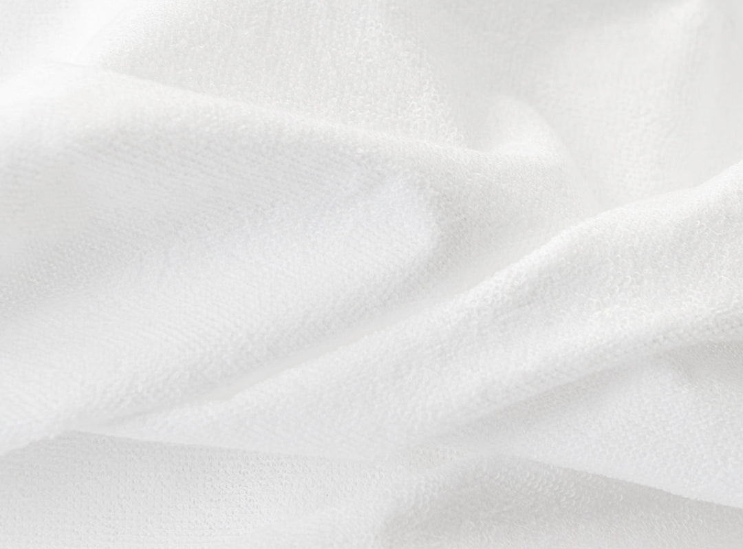 A closeup of the Waterproof Mattress Protector showing it's soft, waterproof fibers