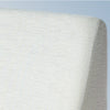 A closeup image of the Helix Wedge Pillow on a blue background