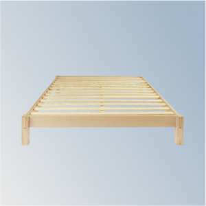 Wooden bed frame on a light blue background